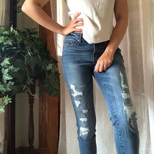 distressed mid rise skinny jean